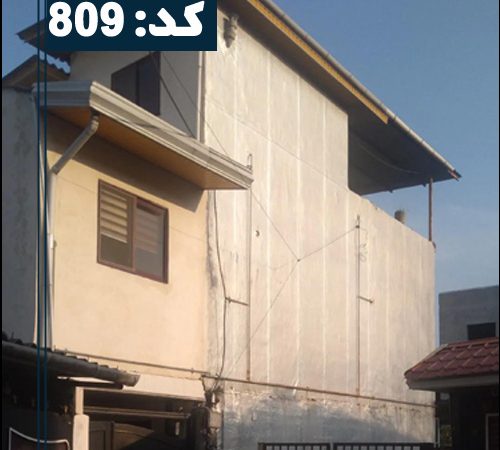 نما سیمان سفید ساختمان دو طبقه و درب مشکی آپارتمان در ایزدشهر 1465468468544